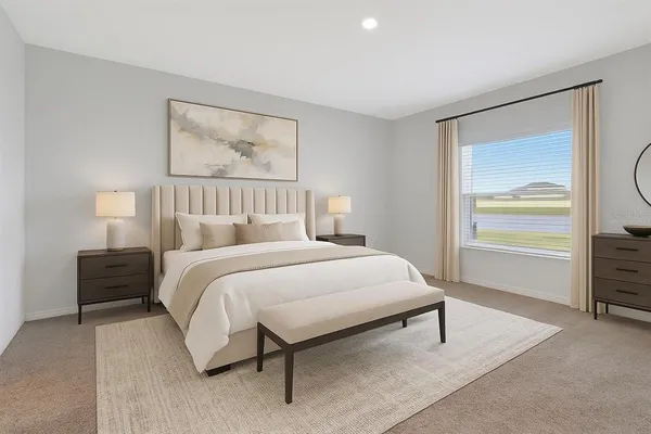 a bedroom with a bed and a painting on the wall