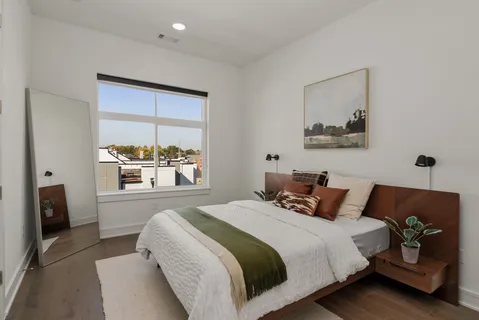 a bedroom with a bed and a closet