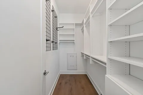 a view of a balcony with furniture and floor to ceiling window
