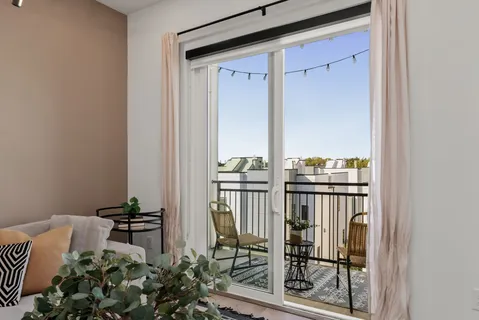 a view of a balcony with furniture