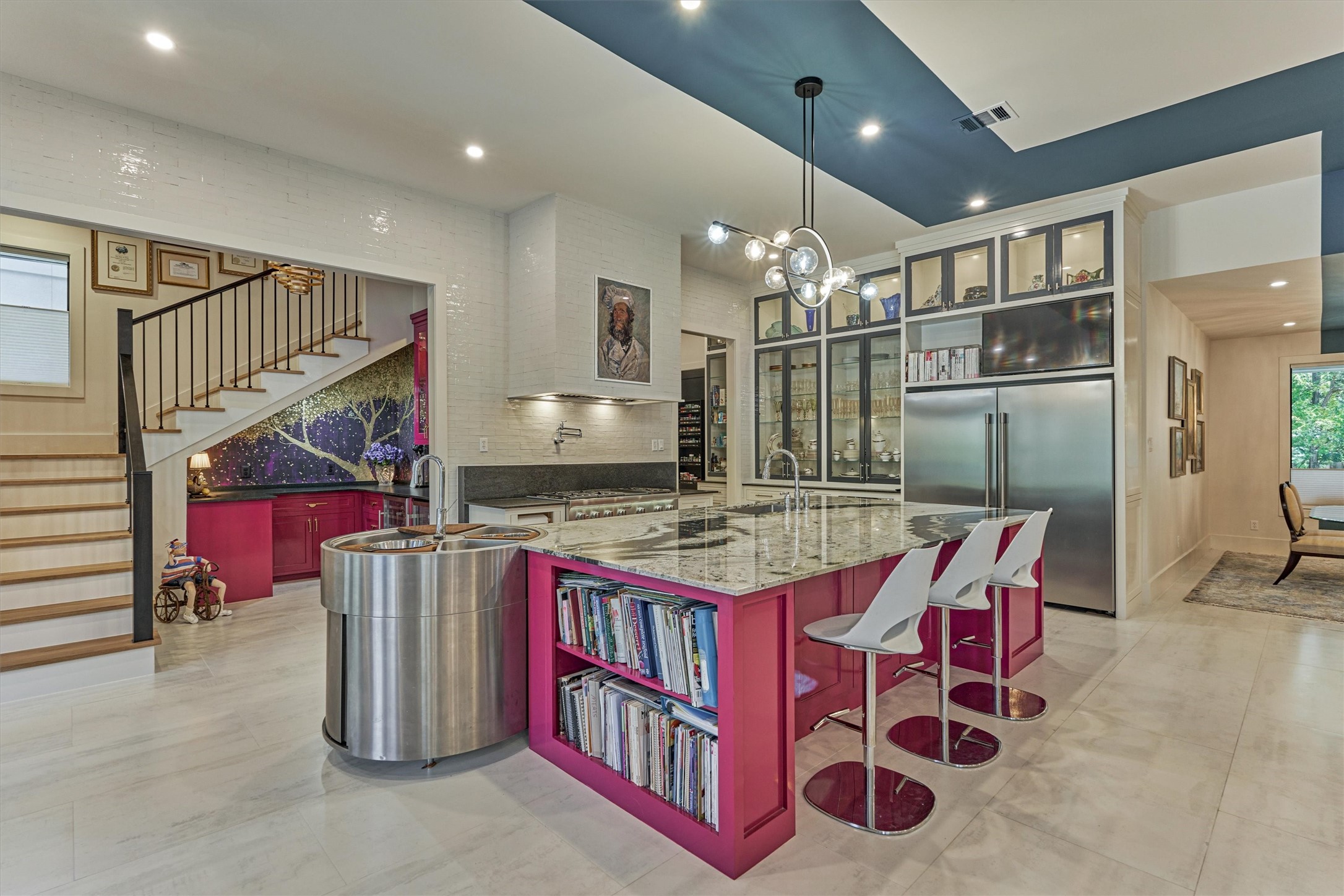 15 Atrium Woods Court The Woodlands, TX 77381 - Photo 12 of 50 a kitchen with granite countertop a table and chairs