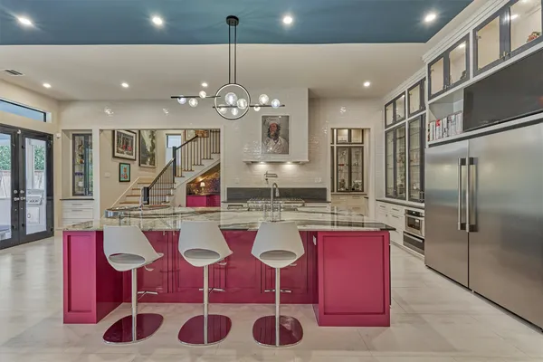 a kitchen with lots of counter space and refrigerator