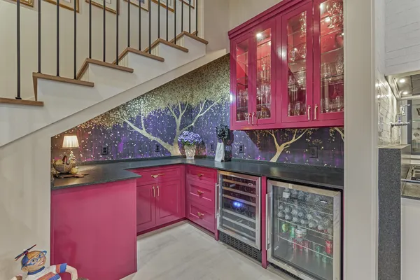 a kitchen with stainless steel appliances granite countertop a stove and cabinets