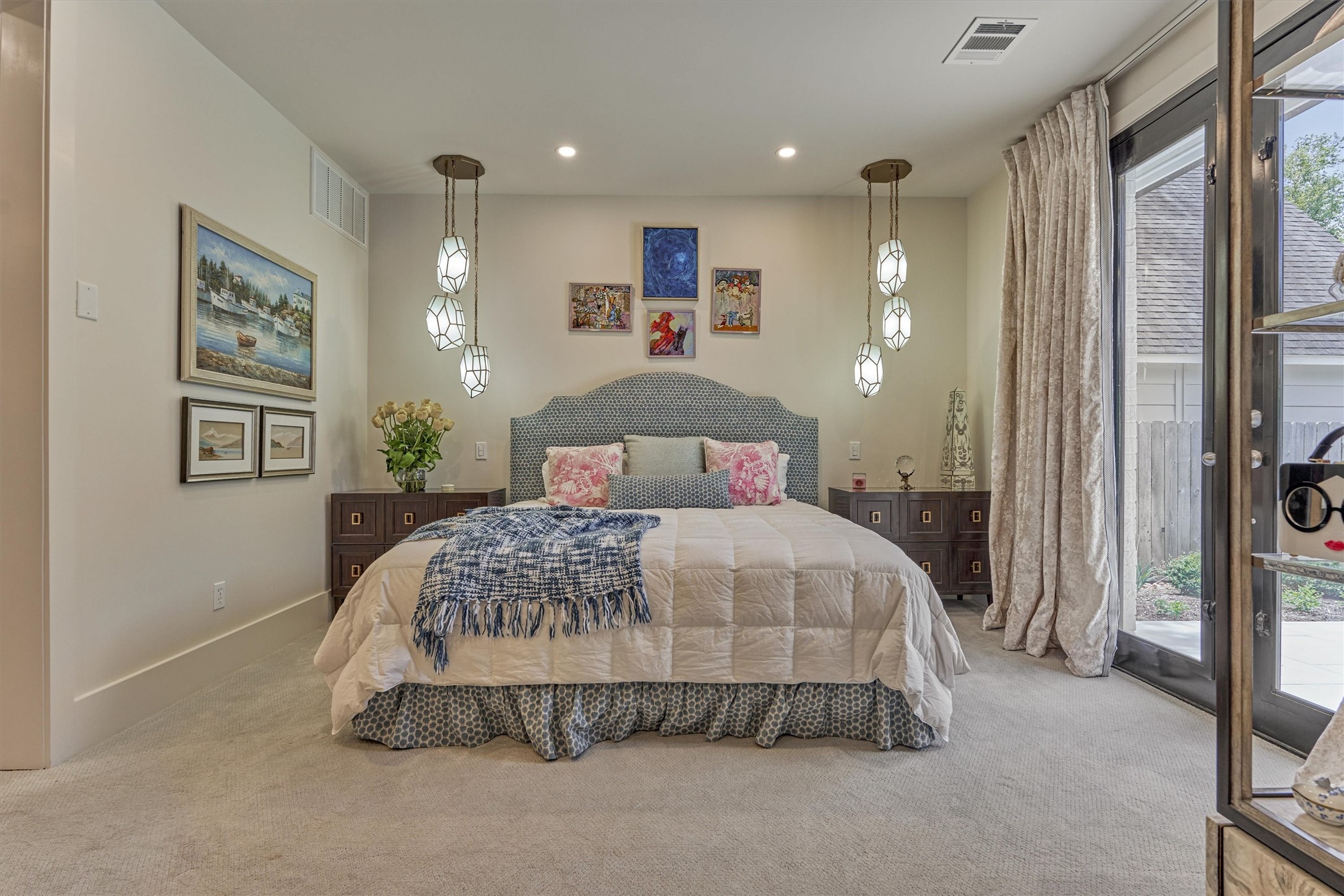 15 Atrium Woods Court The Woodlands, TX 77381 - Photo 19 of 50 a bedroom with a bed and a large mirror