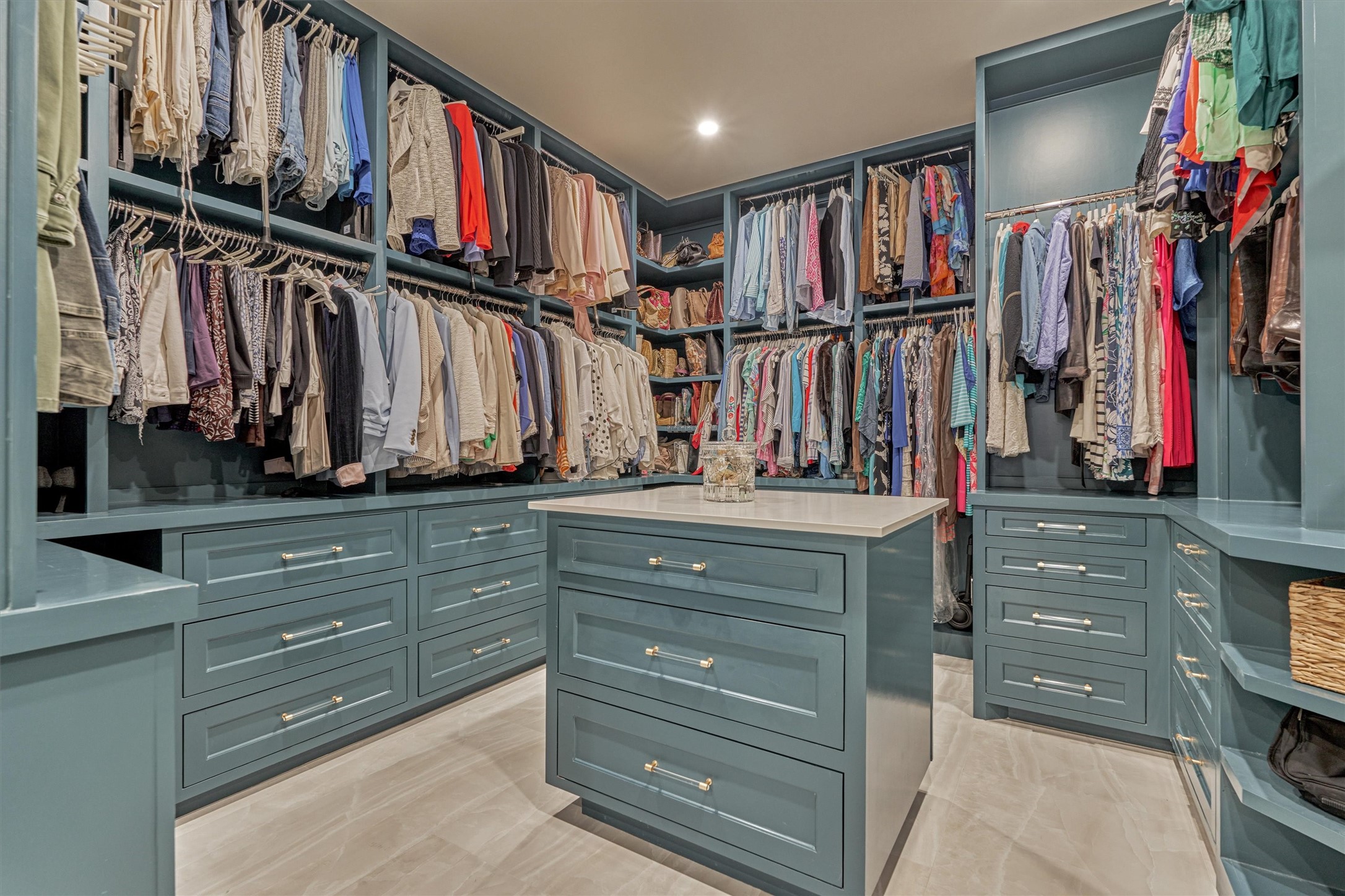 15 Atrium Woods Court The Woodlands, TX 77381 - Photo 26 of 50 a view of walk in closet with clothes and shoes