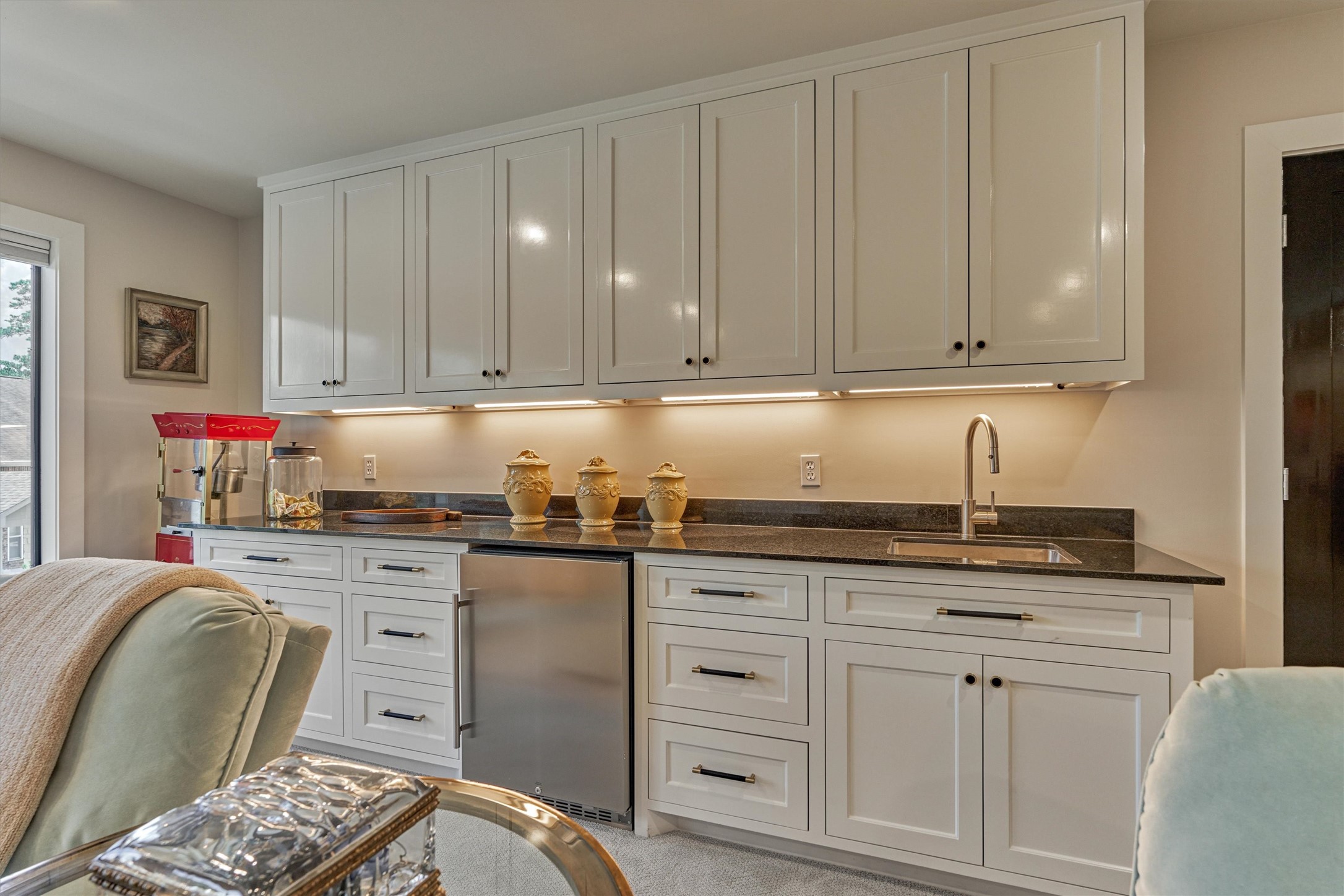 15 Atrium Woods Court The Woodlands, TX 77381 - Photo 33 of 50 a kitchen with granite countertop a sink and cabinets