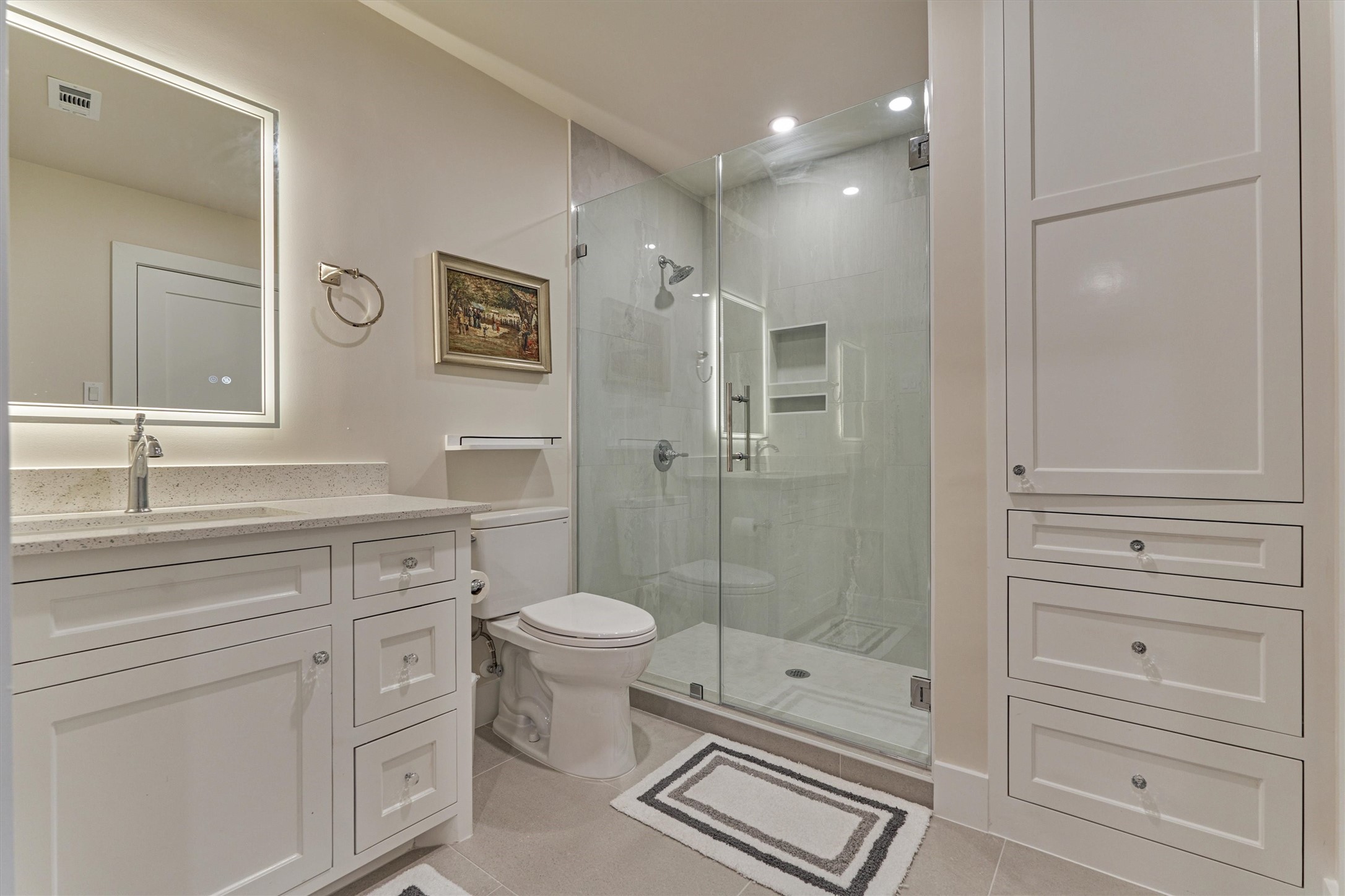 15 Atrium Woods Court The Woodlands, TX 77381 - Photo 35 of 50 a bathroom with a shower toilet sink and mirror