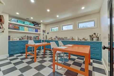 a dining room with a table and chairs