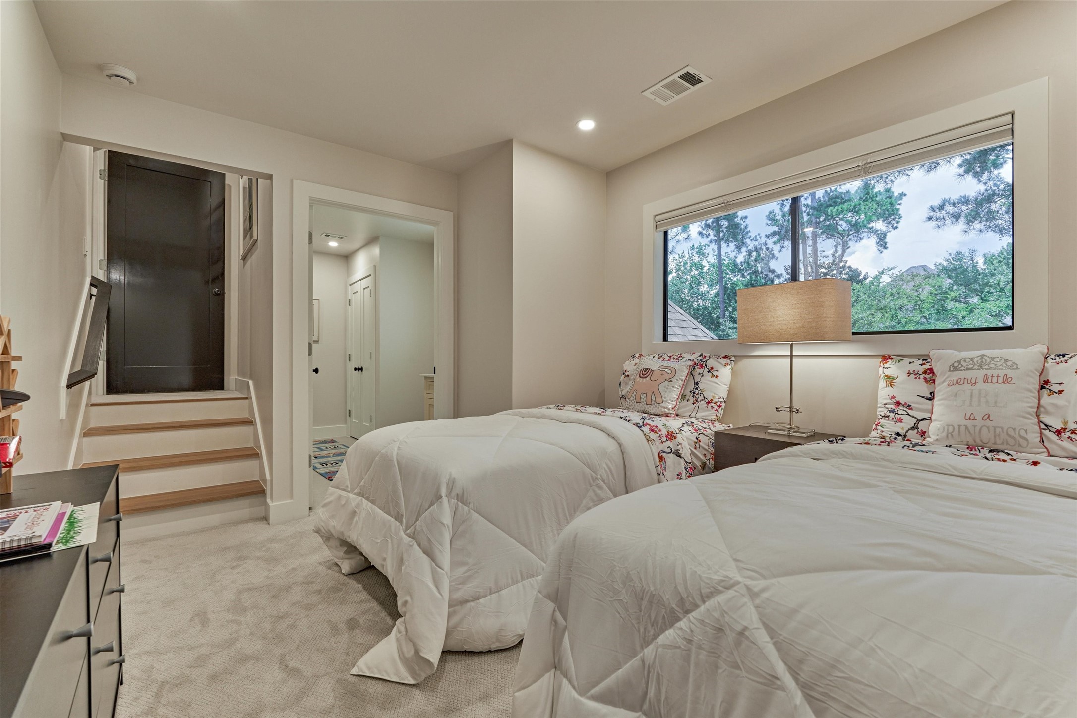 15 Atrium Woods Court The Woodlands, TX 77381 - Photo 38 of 50 a bedroom with two beds and a large window