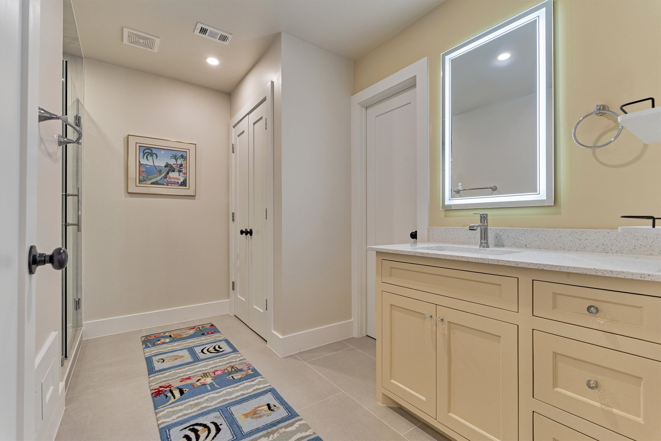 15 Atrium Woods Court The Woodlands, TX 77381 - Photo 39 of 50 a bathroom with a sink a vanity and a mirror