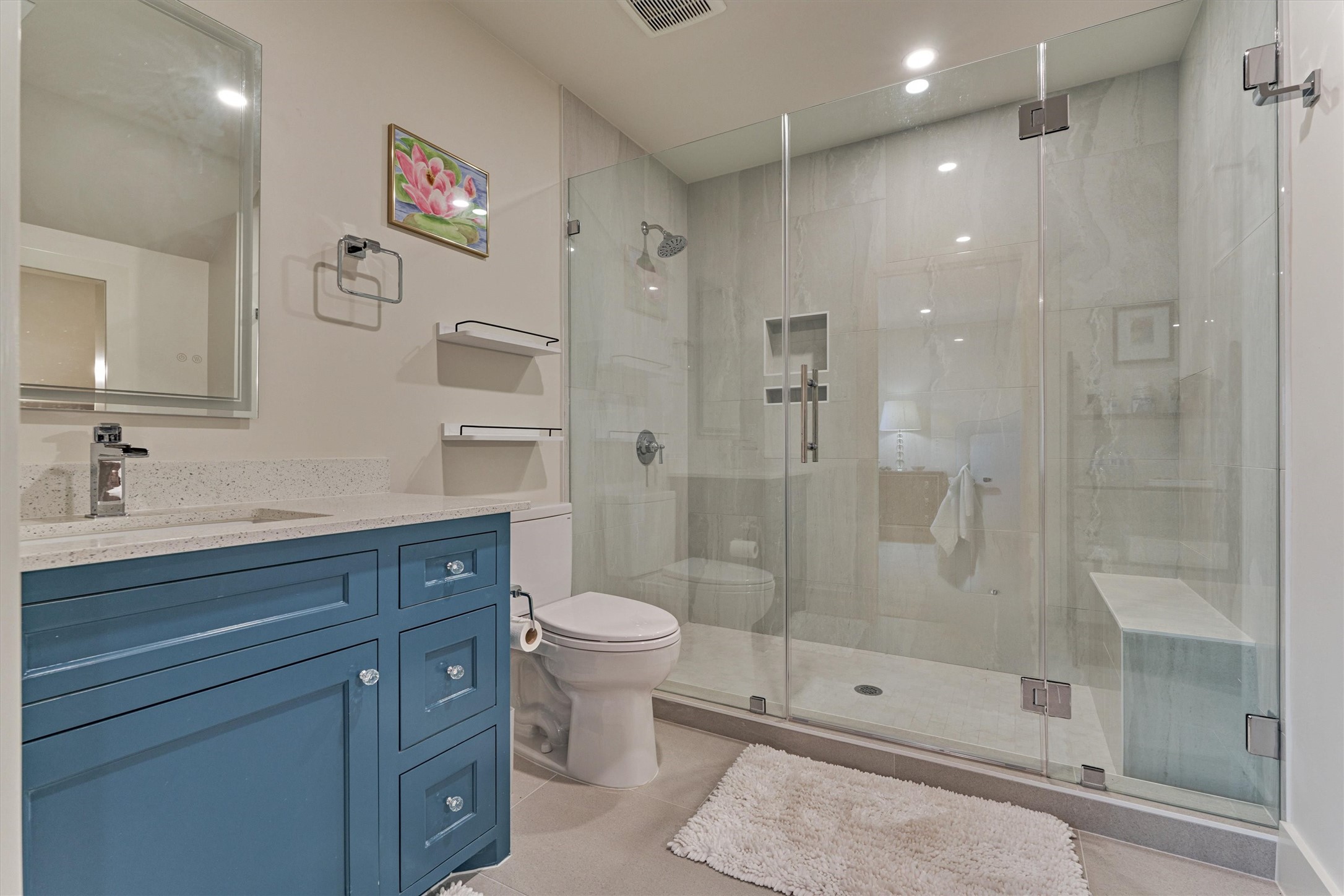 15 Atrium Woods Court The Woodlands, TX 77381 - Photo 41 of 50 a bathroom with a shower sink vanity mirror and toilet