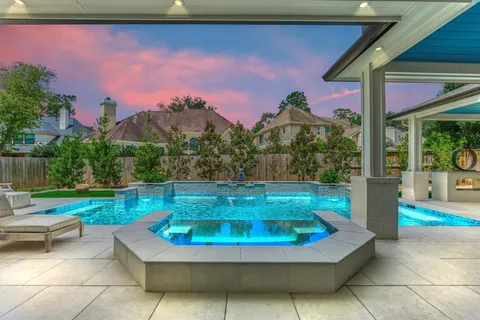 a view of a swimming pool with a patio