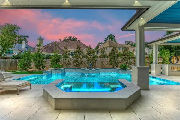 a view of a swimming pool with a patio