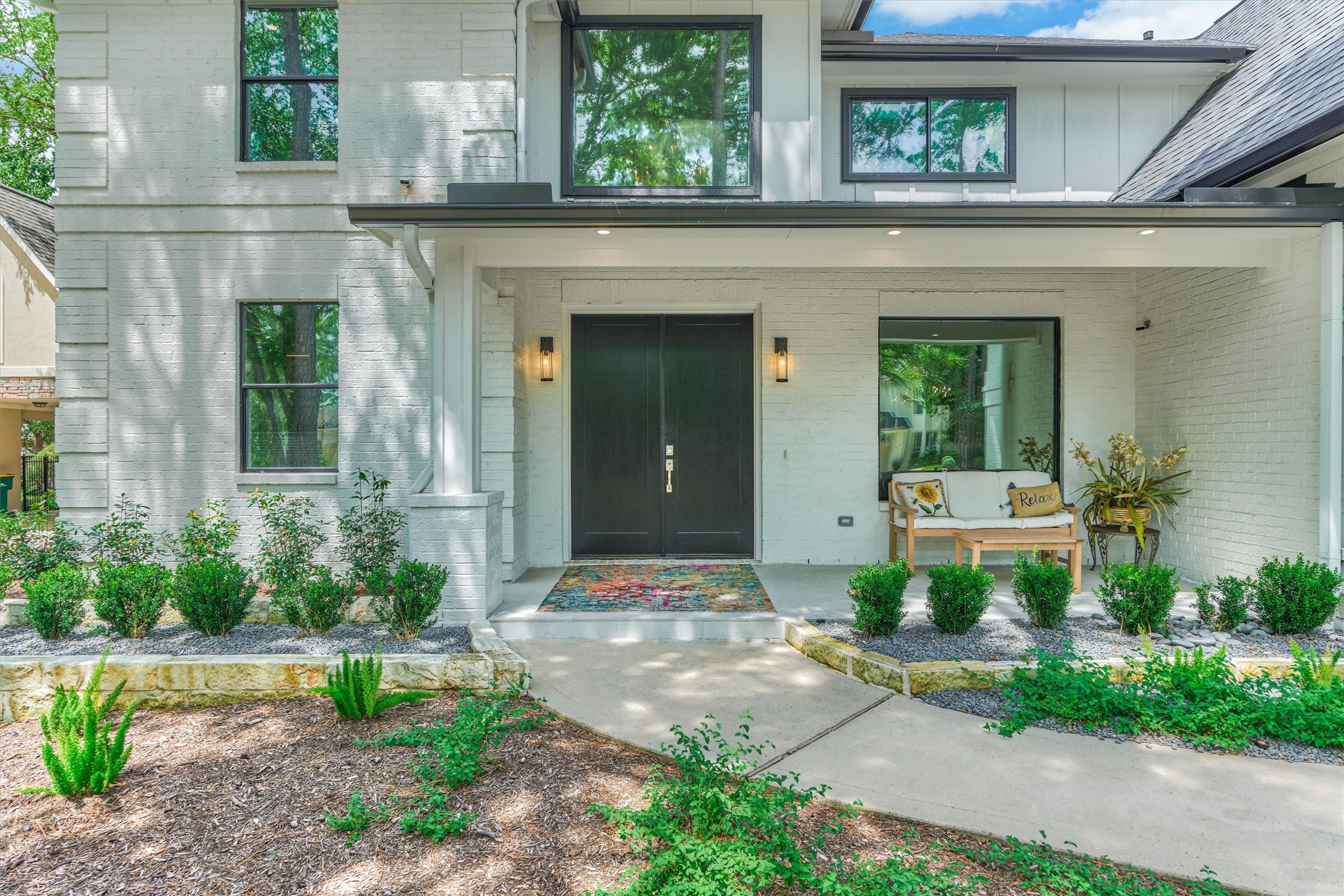 15 Atrium Woods Court The Woodlands, TX 77381 - Photo 5 of 50 a front view of a house with garden