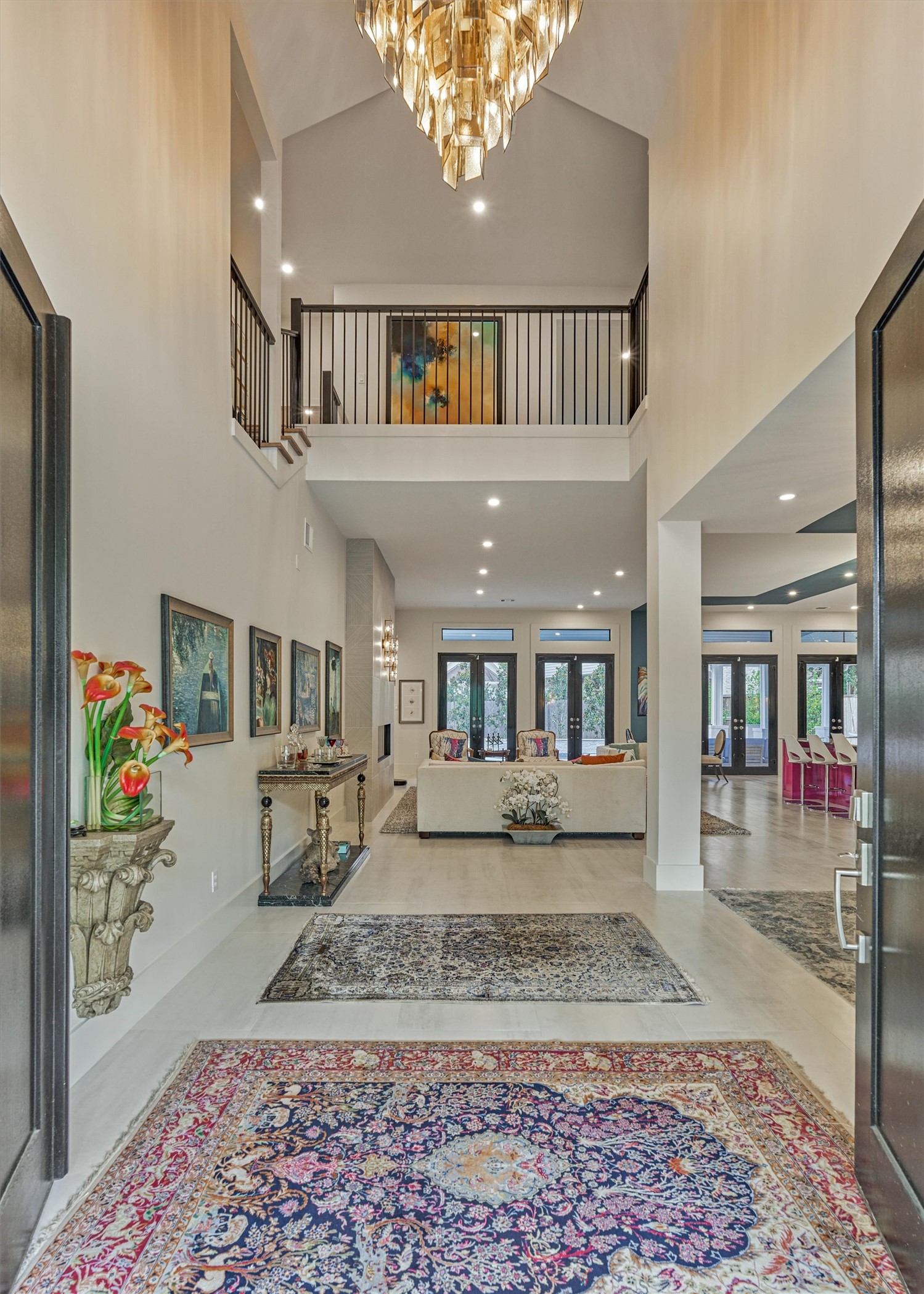 15 Atrium Woods Court Spring, TX 77381 - Photo 6 of 50 Step inside the grand two-story entrance of this one-of-a-kind "gallery" home with impeccable sightlines into the transformed living areas and out to the backyard oasis.