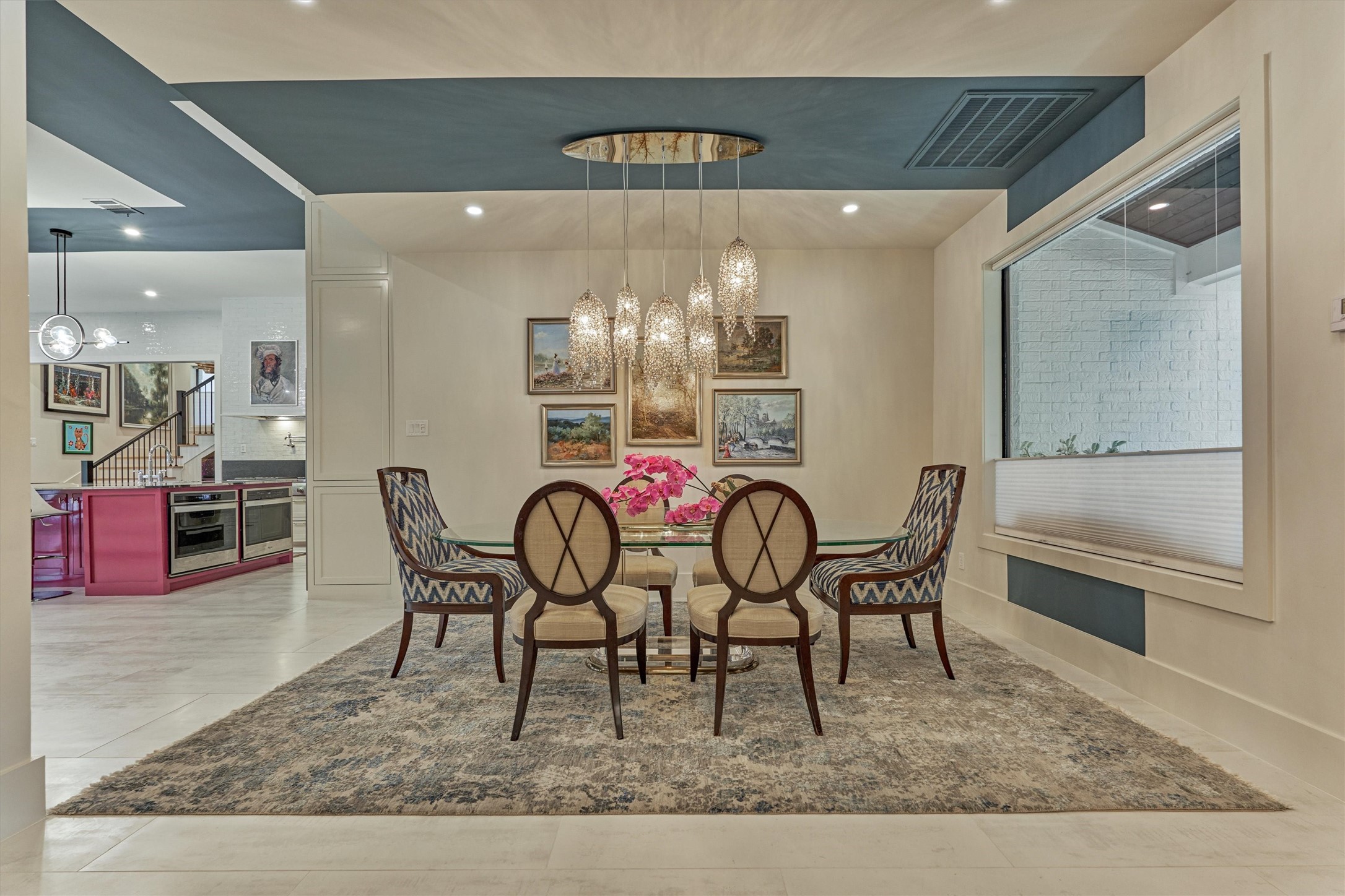 15 Atrium Woods Court The Woodlands, TX 77381 - Photo 8 of 50 a view of a dining room with furniture and chandelier