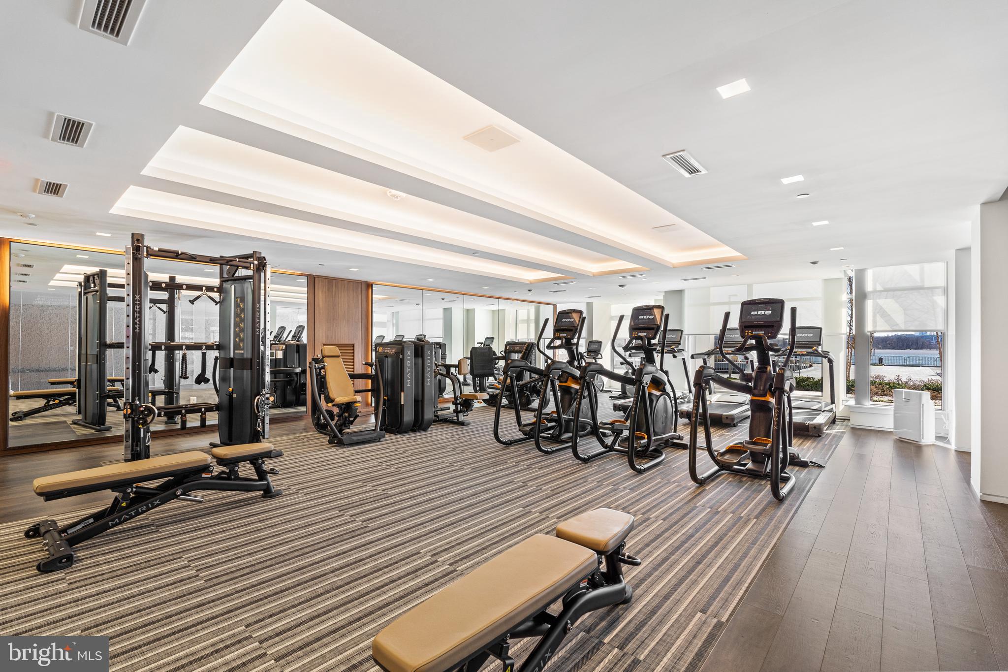 310 Strand Street, Unit 204 Alexandria, VA 22314 - Photo 5 of 11 a view of a room with gym equipment