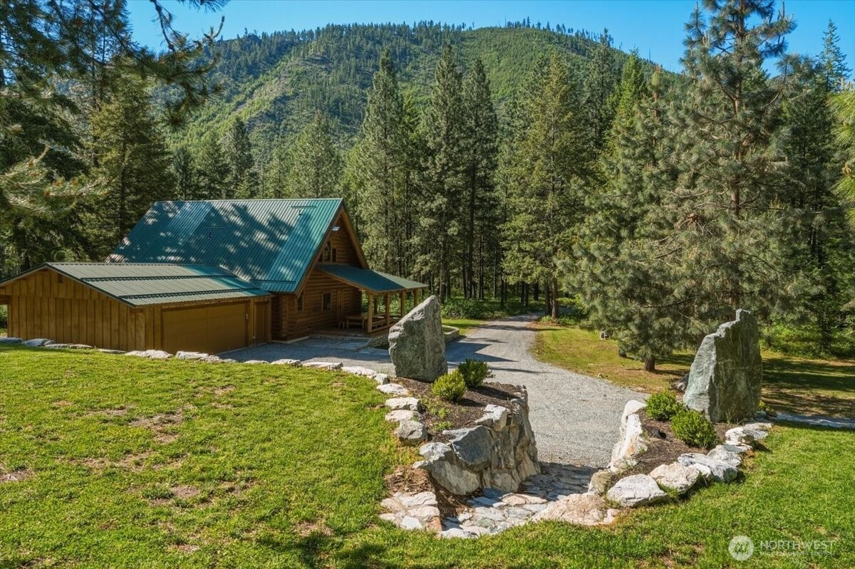 2250 First Crk Road Chelan, WA 98816 - Photo 1 of 39 a view of a house with yard and lake view