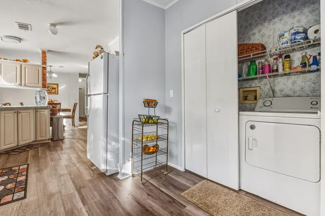 a view of kitchen with furniture and wooden floor