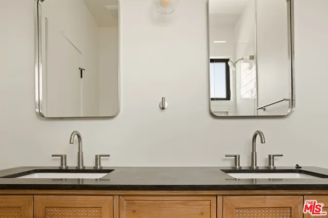 a bathroom with sink and mirror