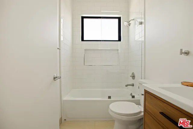 a bathroom with a toilet a sink and a bathtub