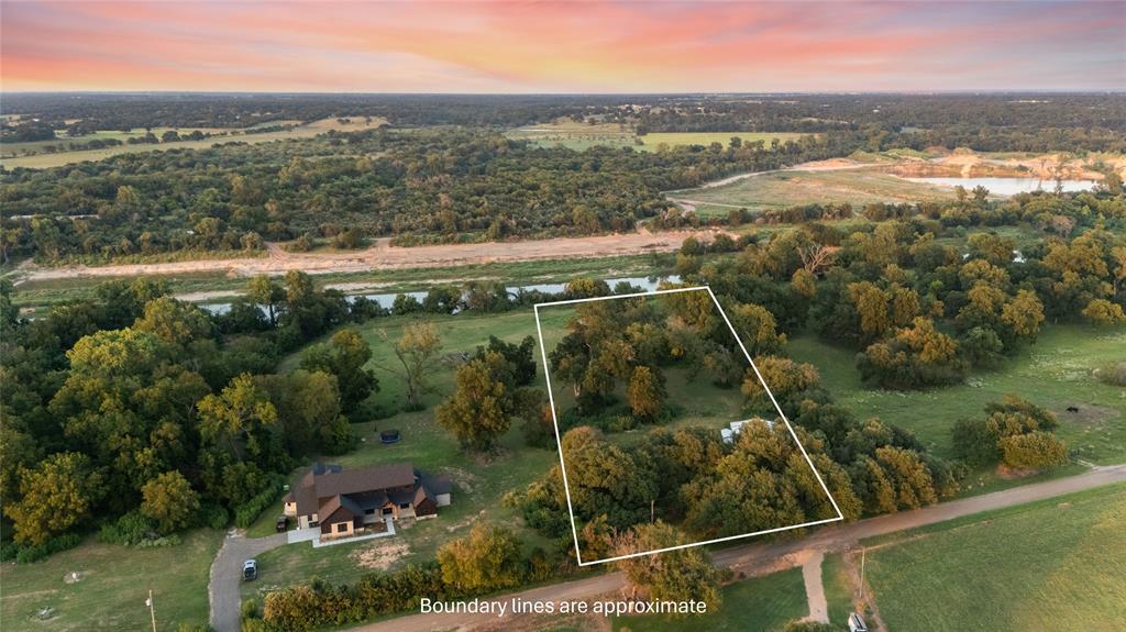 Tbd Horseshoe Bend Road Waco, TX 76708 - Photo 18 of 23 a view of a city from a lake