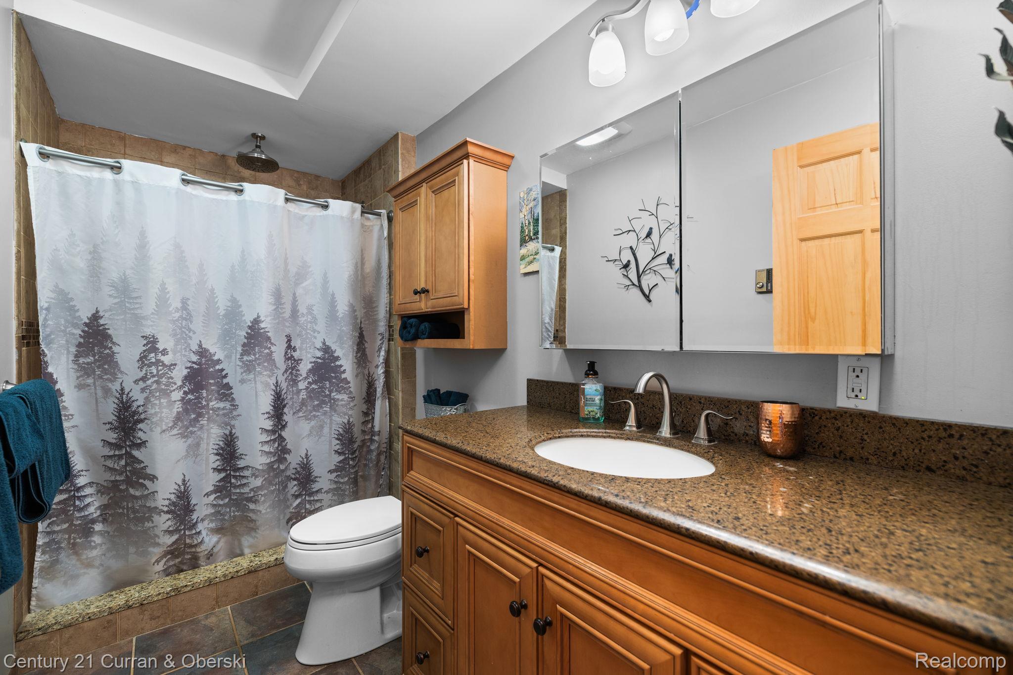 3265 Roost Road Onaway, MI 49765 - Photo 21 of 52 Full bath featuring vanity and a stall shower