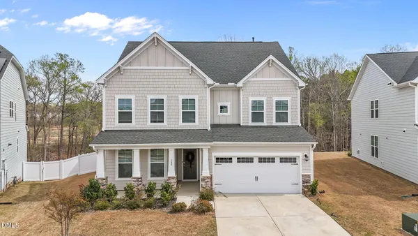 front view of a house with a yard