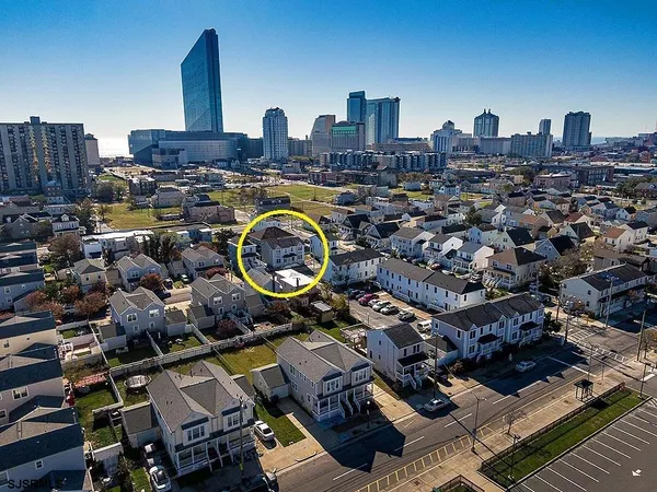 an aerial view of a house with outdoor space