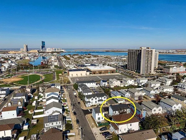 an aerial view of residential building and parking space