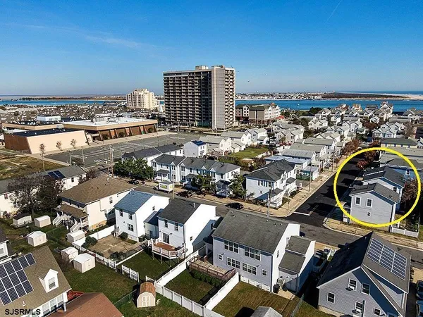 an aerial view of a city with ocean view
