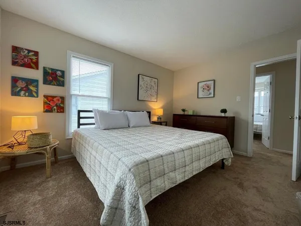 a bedroom with a bed and furniture