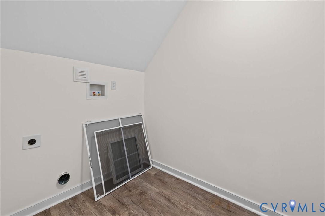11325 Webb Road Disputanta, VA 23842 - Photo 29 of 32 a view of an empty room with wooden floor and cabinet