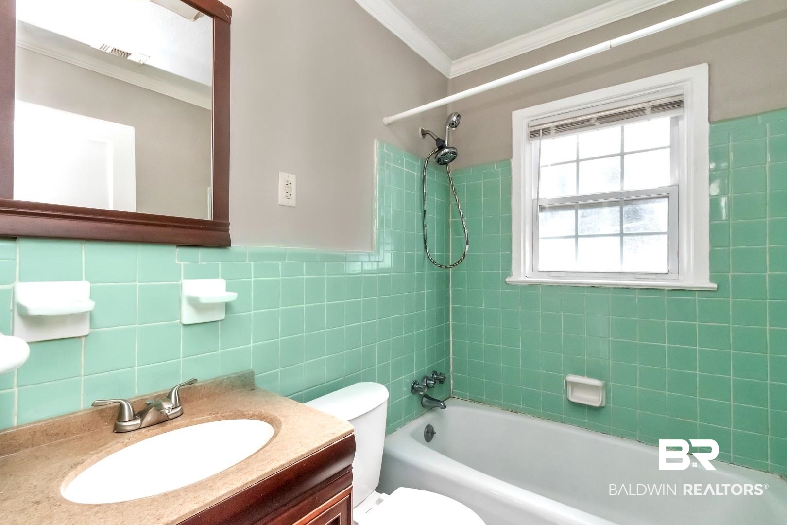165 East Collins Street Mobile, AL 36606 - Photo 14 of 19 Bathroom featuring crown molding, tile walls, toilet, tub / shower combination, and vanity