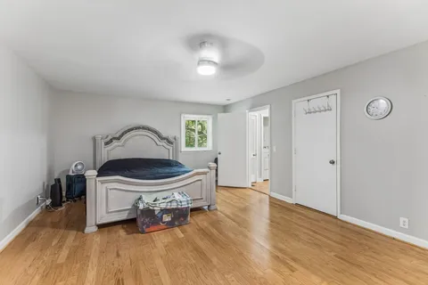 a bedroom with a bed and a table