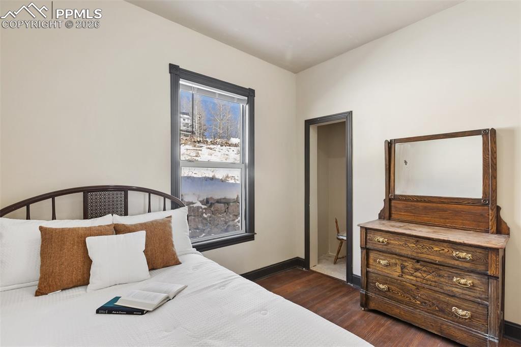 112 6th Street Victor, CO 80860 - Photo 13 of 35 a bedroom with a bed and a dresser