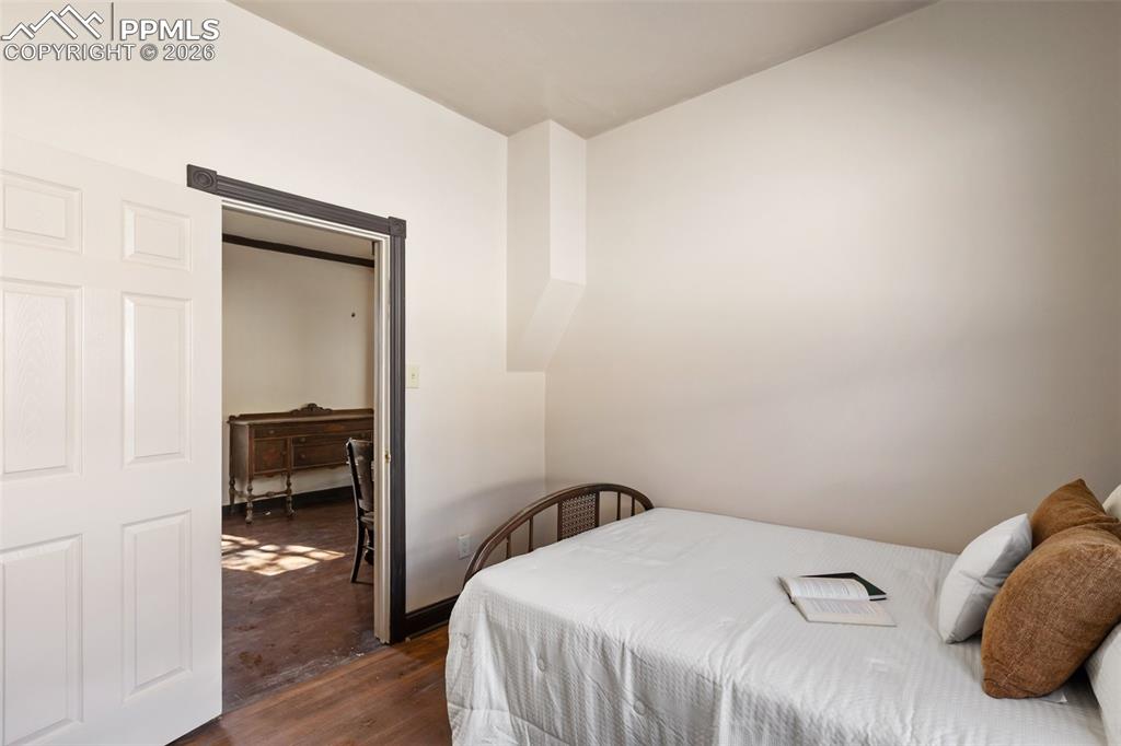 112 6th Street Victor, CO 80860 - Photo 15 of 35 a bedroom with a bed and a chair