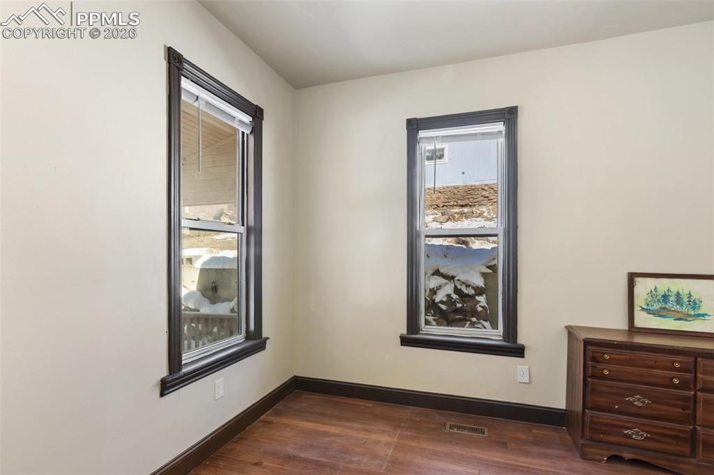 112 6th Street Victor, CO 80860 - Photo 17 of 35 a view of a hallway with front door and wooden floor