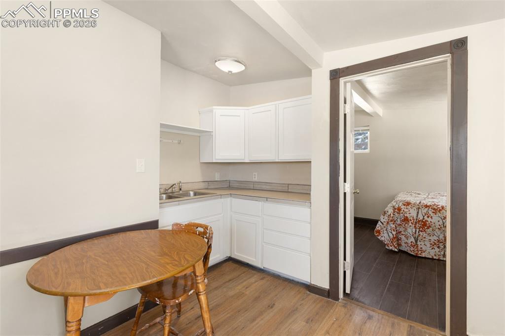 112 6th Street Victor, CO 80860 - Photo 23 of 35 a kitchen with a table and a refrigerator