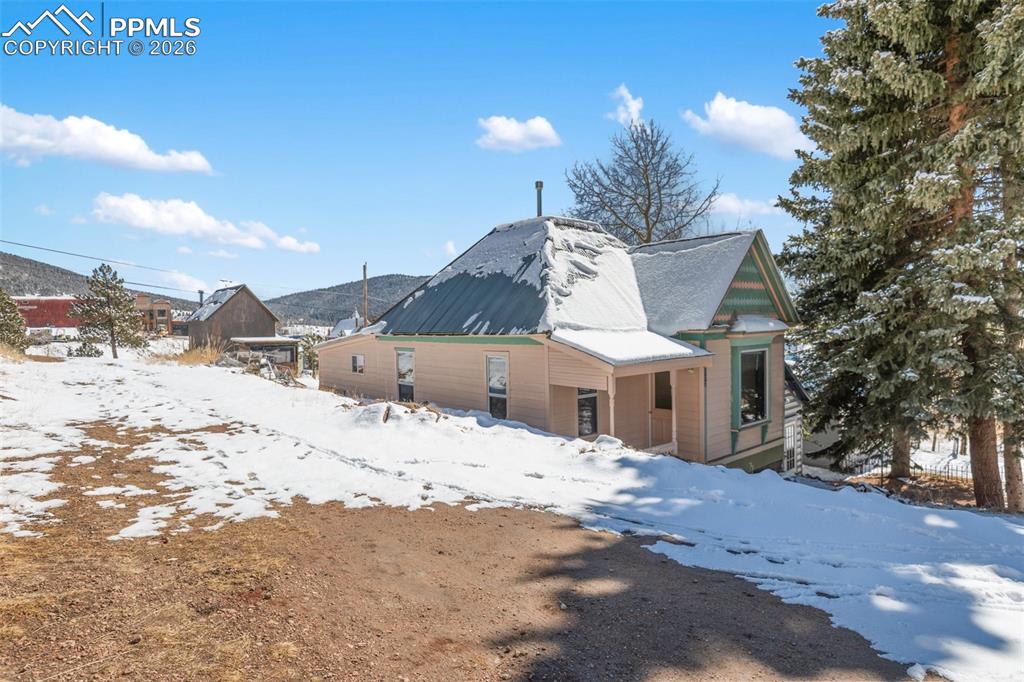 112 6th Street Victor, CO 80860 - Photo 5 of 35 a view of a house with a snow in the yard