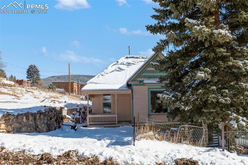 112 6th Street Victor, CO 80860 - Photo 6 of 35 a view of a house with a yard covered in snow