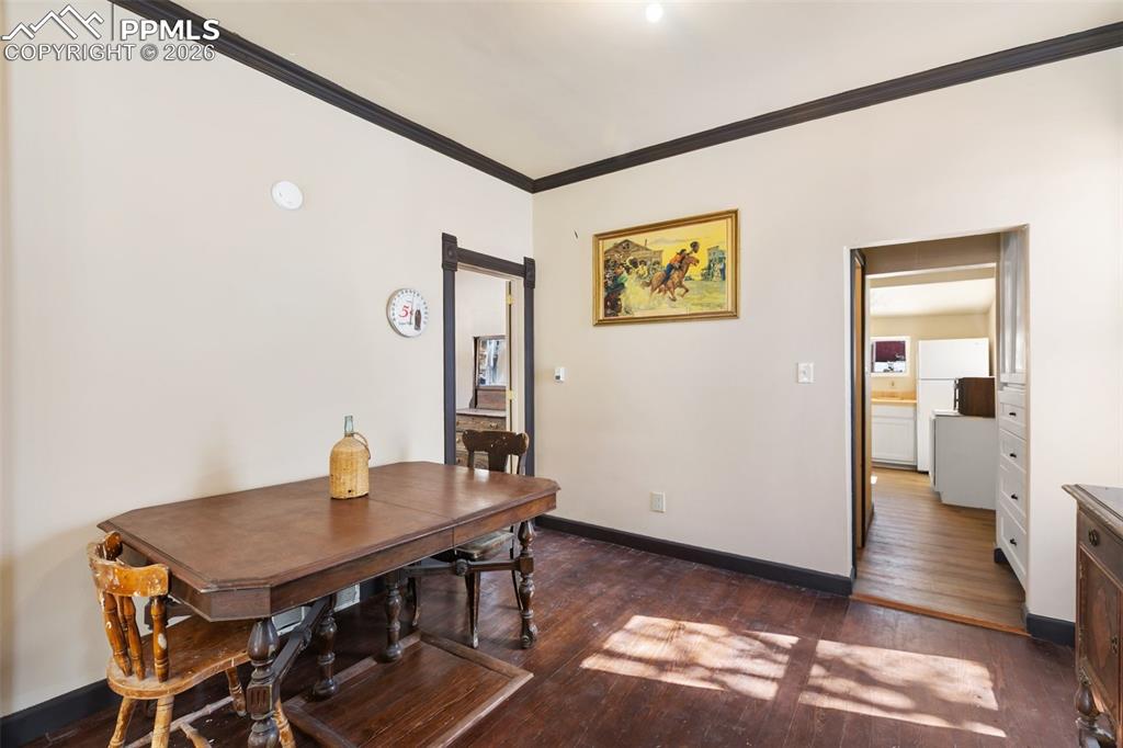 112 6th Street Victor, CO 80860 - Photo 10 of 35 a view of a dining room with furniture and wooden floor