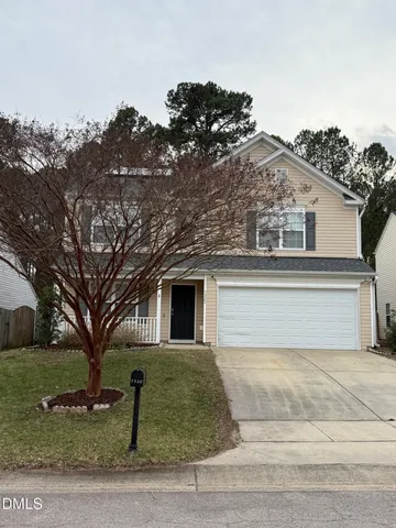 front view of a house with a dry yard