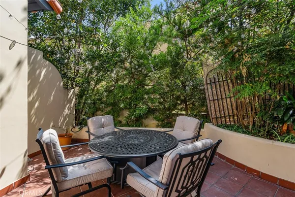 a view of a chairs and table in the patio