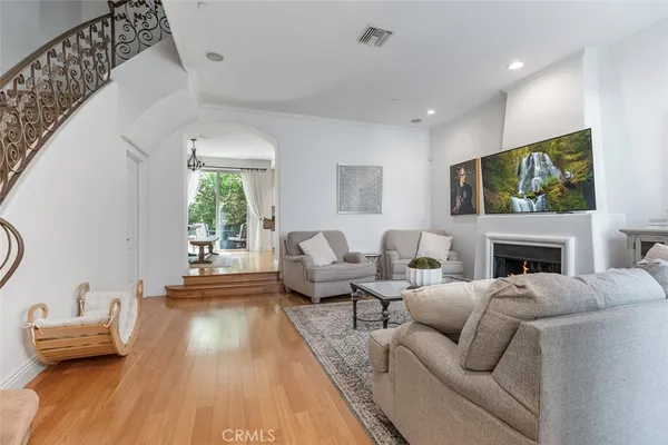a living room with furniture fireplace and flat screen tv
