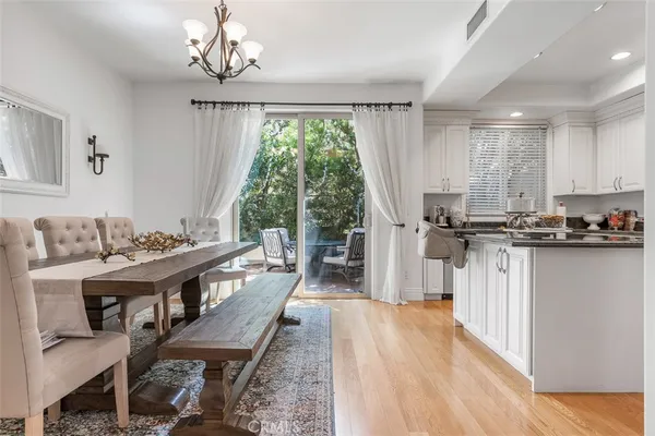 a kitchen with kitchen island granite countertop lots of counter top space and stainless steel appliances