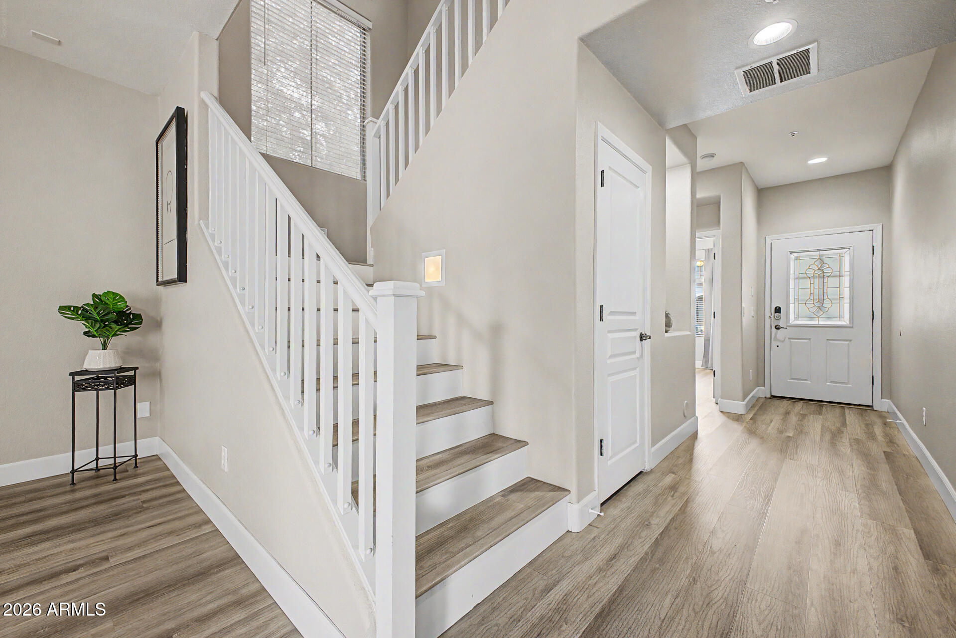 1379 East Joseph Way Gilbert, AZ 85295 - Photo 12 of 44 a view of a hallway with wooden floor and staircase