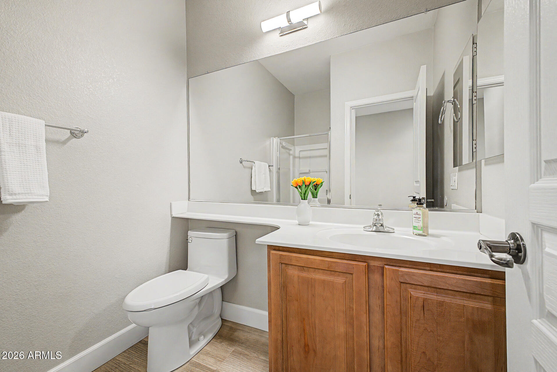 1379 East Joseph Way Gilbert, AZ 85295 - Photo 15 of 44 a bathroom with a granite countertop toilet sink and mirror
