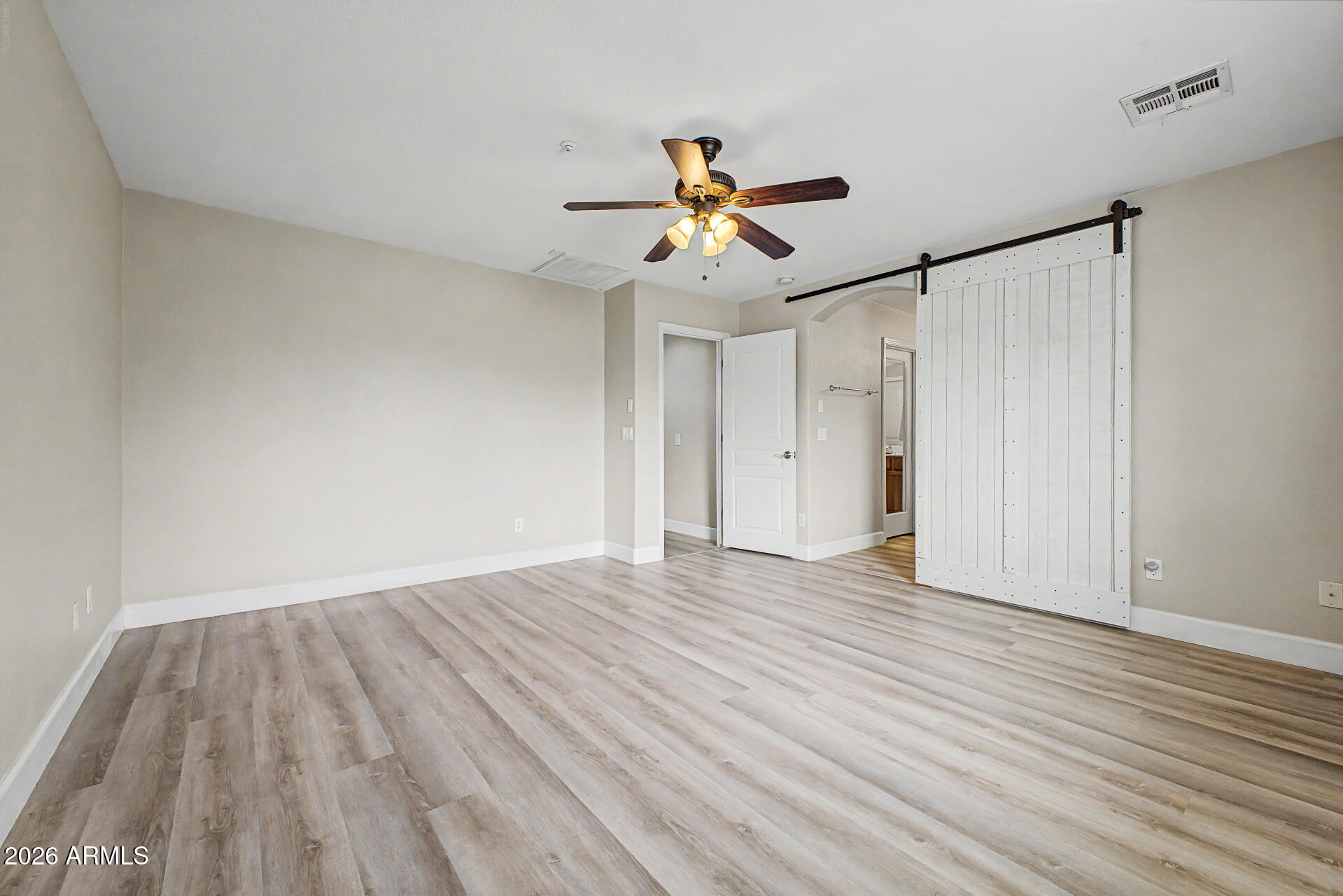 1379 East Joseph Way Gilbert, AZ 85295 - Photo 18 of 44 a view of empty room with wooden floor and fan