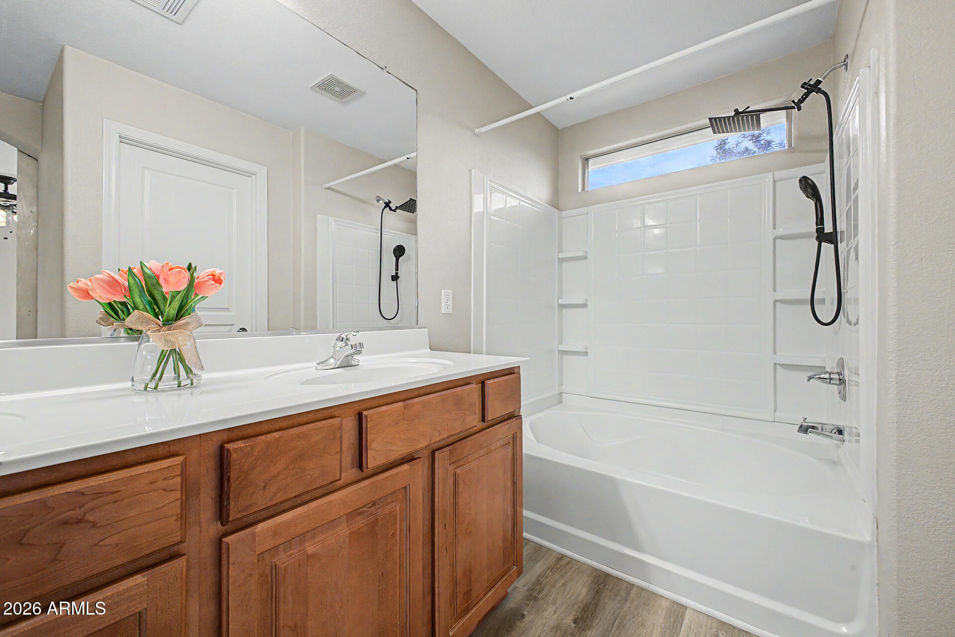 1379 East Joseph Way Gilbert, AZ 85295 - Photo 20 of 44 a bathroom with a tub sink and mirror
